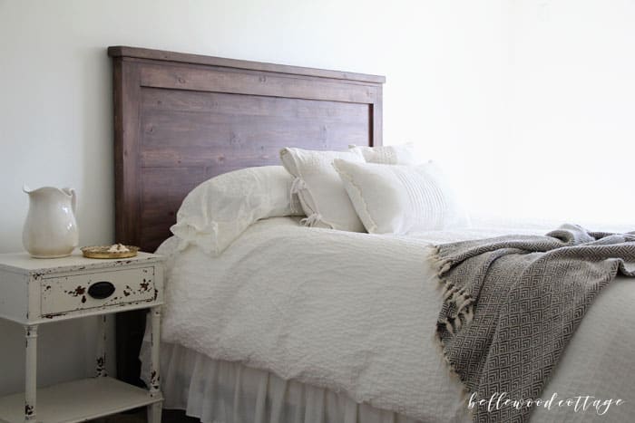 Join me at Bellewood Cottage to learn how to create your own DIY rustic headboard with simple (and inexpensive!) pine boards and milk paint. #BellewoodCottage #diyheadboard #milkpaint #farmhousestyle