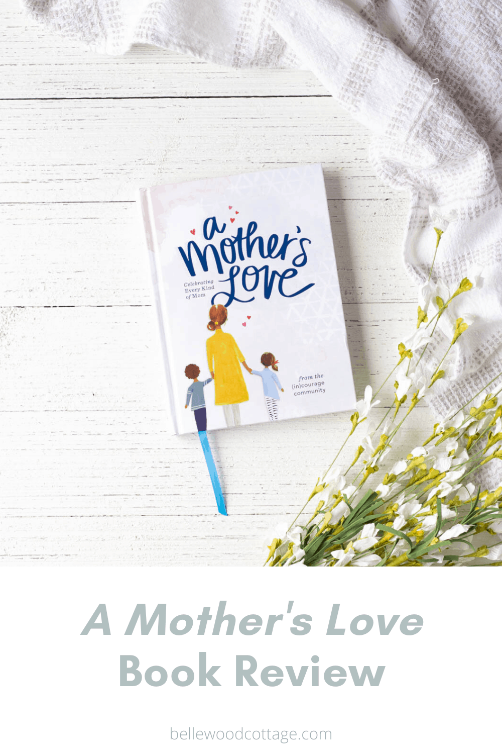 A book, titled A Mother's Love, on a wooden surface.