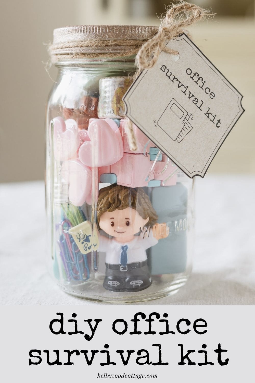 A mason jar filled with office supplies and gift tag with the words, "DIY Office Survival Kit" on the image.