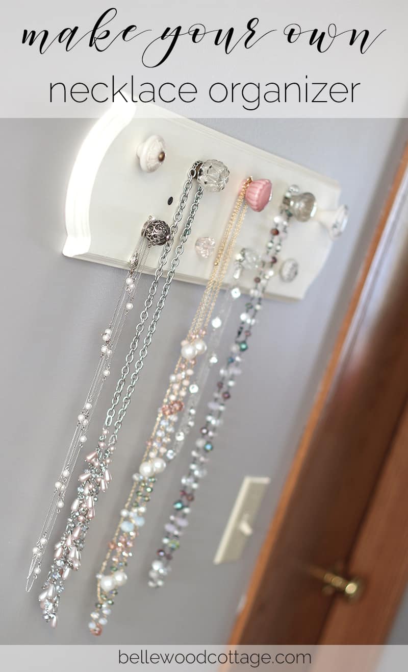 A necklace organizer made with knobs from Hobby Lobby.