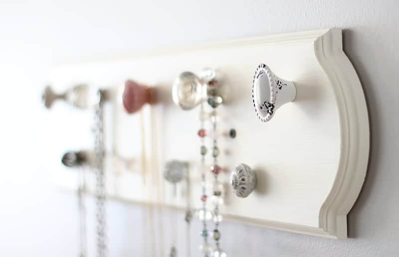 A necklace organizer made with knobs from Hobby Lobby.