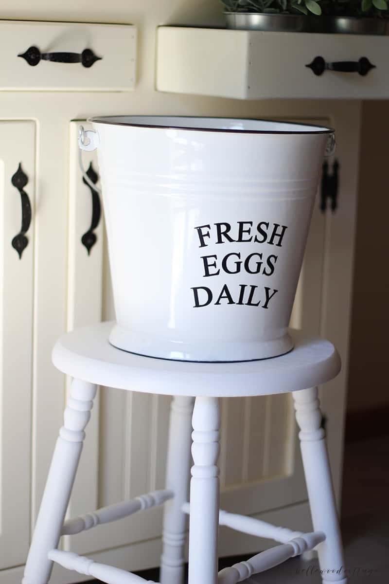 A farmhouse stool painted with white chalk paint.