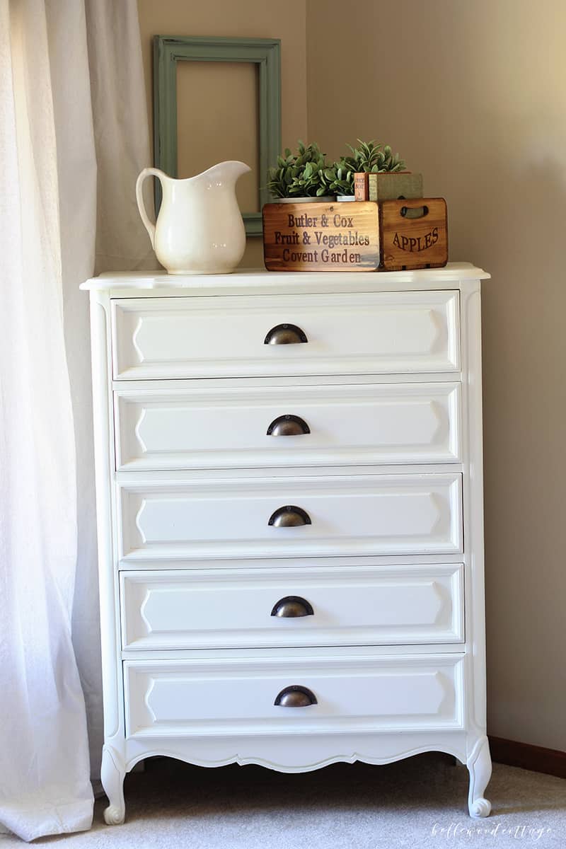 Learn how I transformed this $10 garage sale dresser into a statement French country piece with just a little time and paint. 