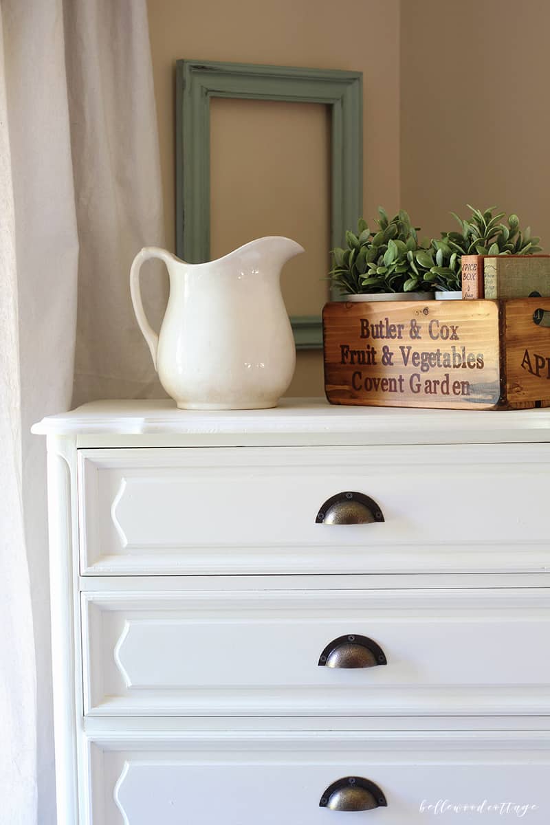 Learn how I transformed this $10 garage sale dresser into a statement French country piece with just a little time and paint. 