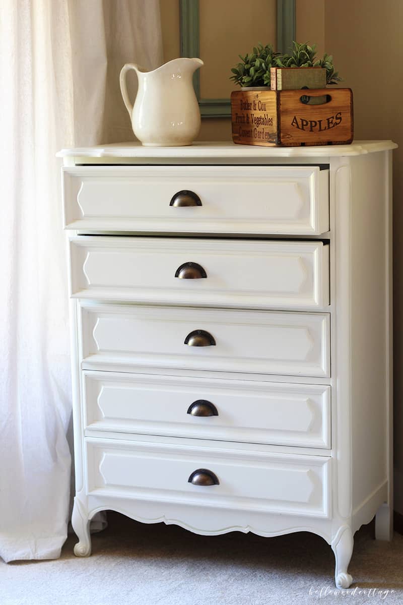 Learn how I transformed this $10 garage sale dresser into a statement French country piece with just a little time and paint. 