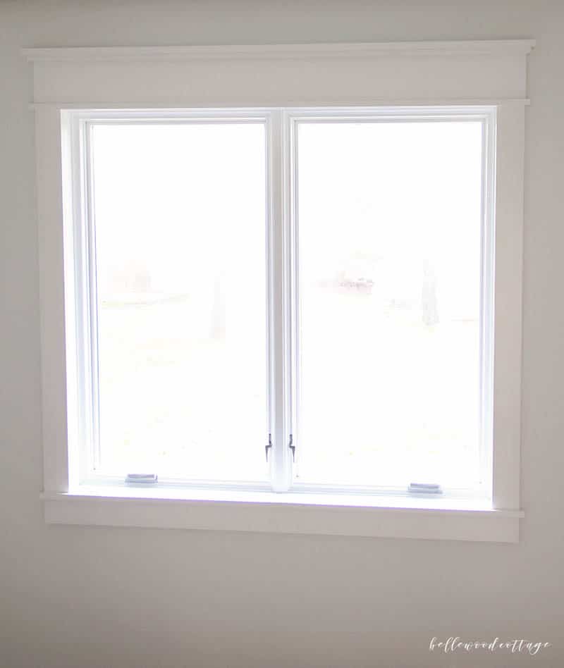 Wondering how to add character to a builder grade home? Learn how to update a boring window with gorgeous (and budget friendly!) farmhouse trim || from Bellewood Cottage ||