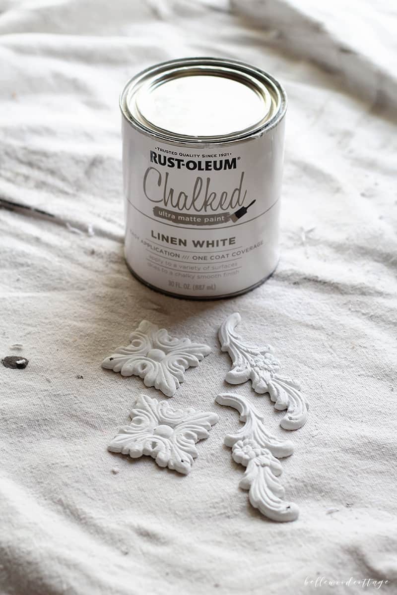 Painting wooden Christmas tree with white chalk paint.