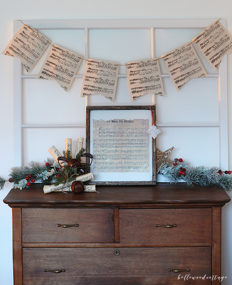 Get inspired to create pretty DIY Christmas decorations with this easy idea for incorporating sheet music decor and fresh pine into your homemade Christmas!