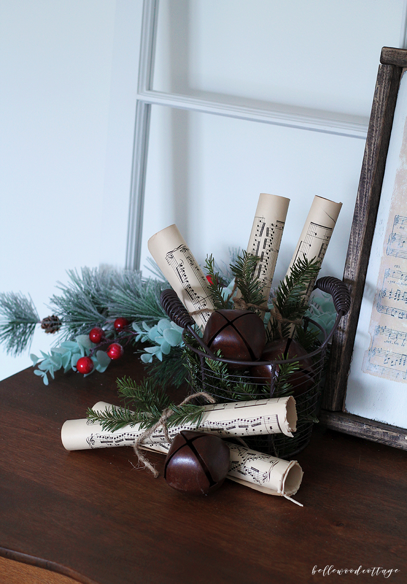 Get inspired to create pretty DIY Christmas decorations with this easy idea for incorporating sheet music decor and fresh pine into your homemade Christmas!