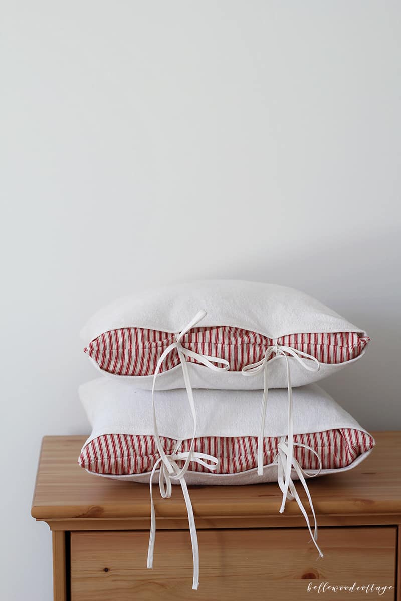 Farmhouse pillow covers made with bleached drop cloth fabric.