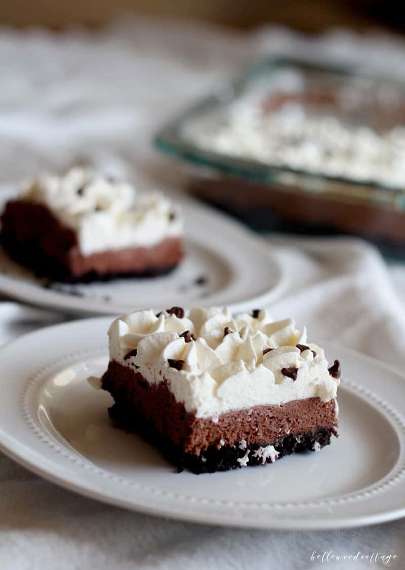 Slices of pie with a 13"x9" baking dish filled with more pie in the background.