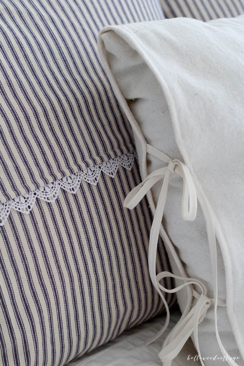 A closeup of a ticking stripe pillow cover.