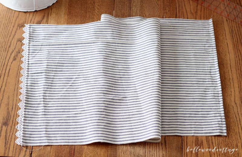 Learn how you can sew farmhouse style pillows with my ticking stripe pillow cover tutorial. This tutorial covers all the steps needed to make these quick and easy-to-sew pillow covers. You'll love the way that ticking stripes give your home an authentic farmhouse vibe!