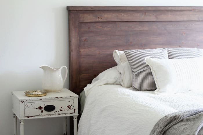 Join me at Bellewood Cottage to learn how to create your own DIY rustic headboard with simple (and inexpensive!) pine boards and milk paint. #BellewoodCottage #diyheadboard #milkpaint #farmhousestyle