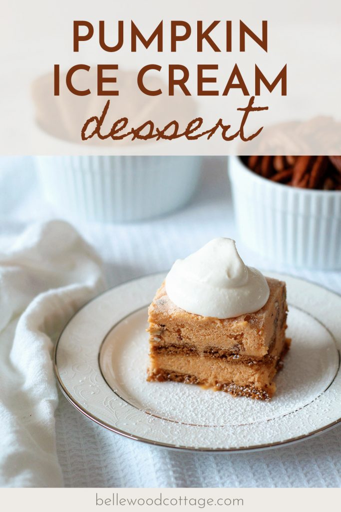 A square of Pumpkin Ice Cream Dessert on a white formal plate surrounded by ramekins of cookies and pecans.