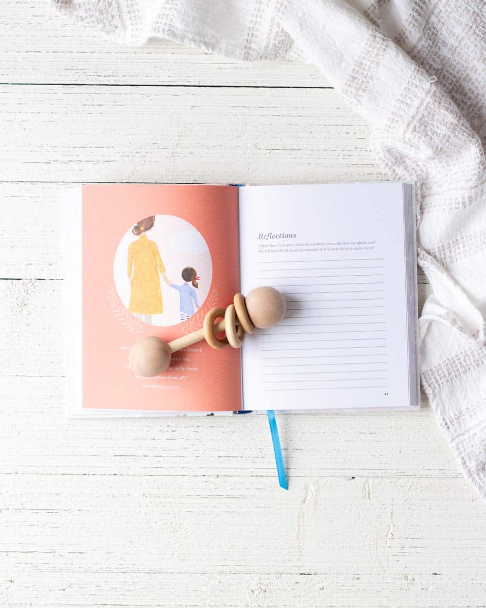 A book, titled A Mother's Love, open on a wooden surface.