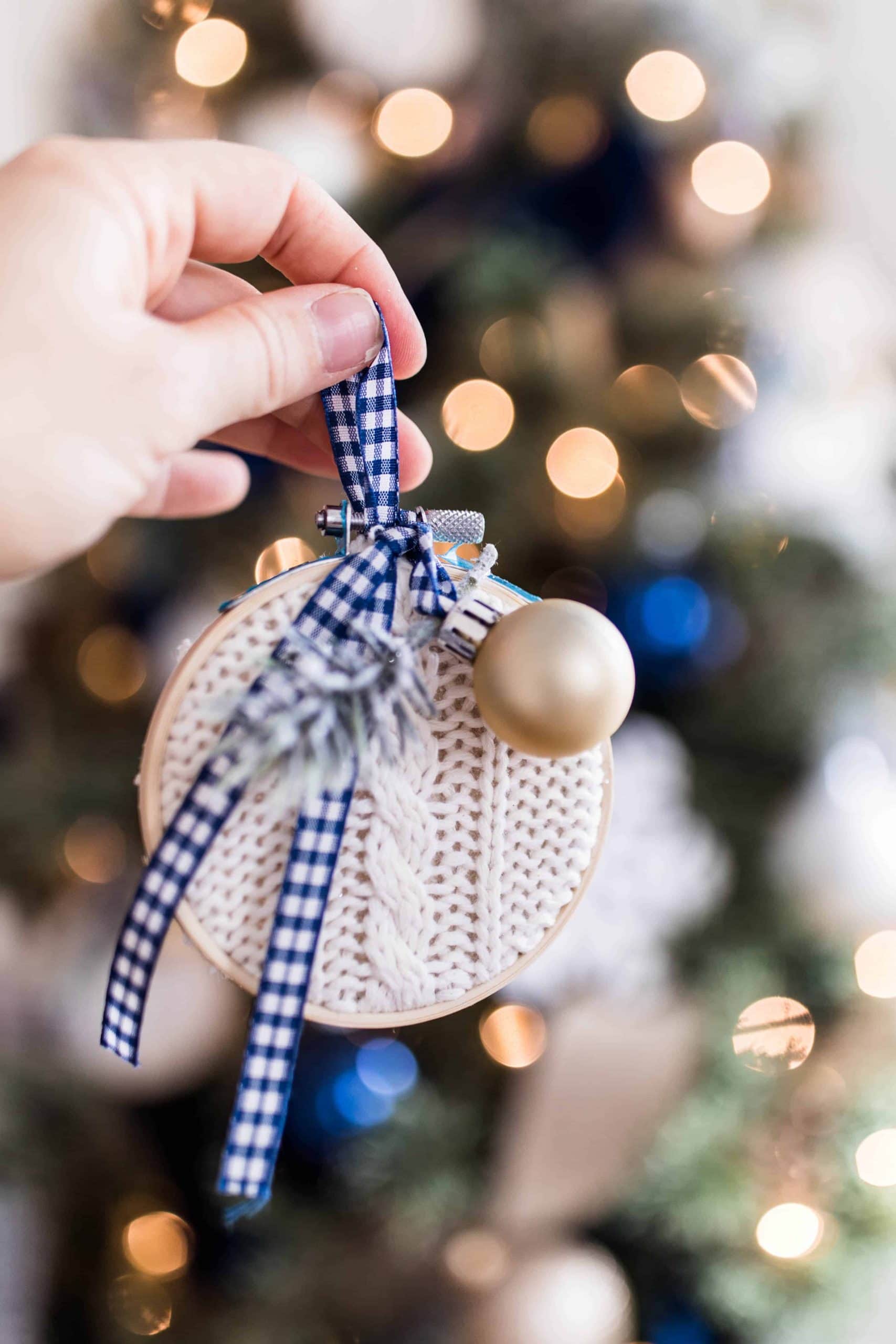 A wooden embroidery hoop made into a Christmas tree ornament.