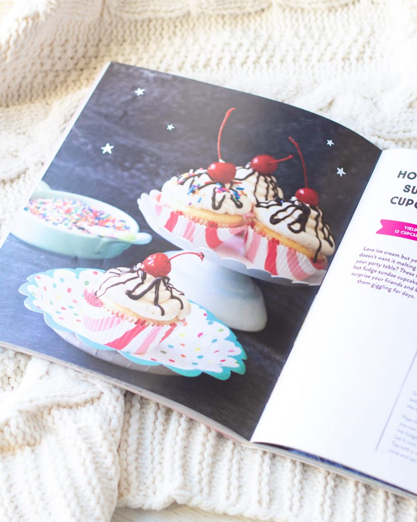 A photograph of cupcakes inside a baking book.