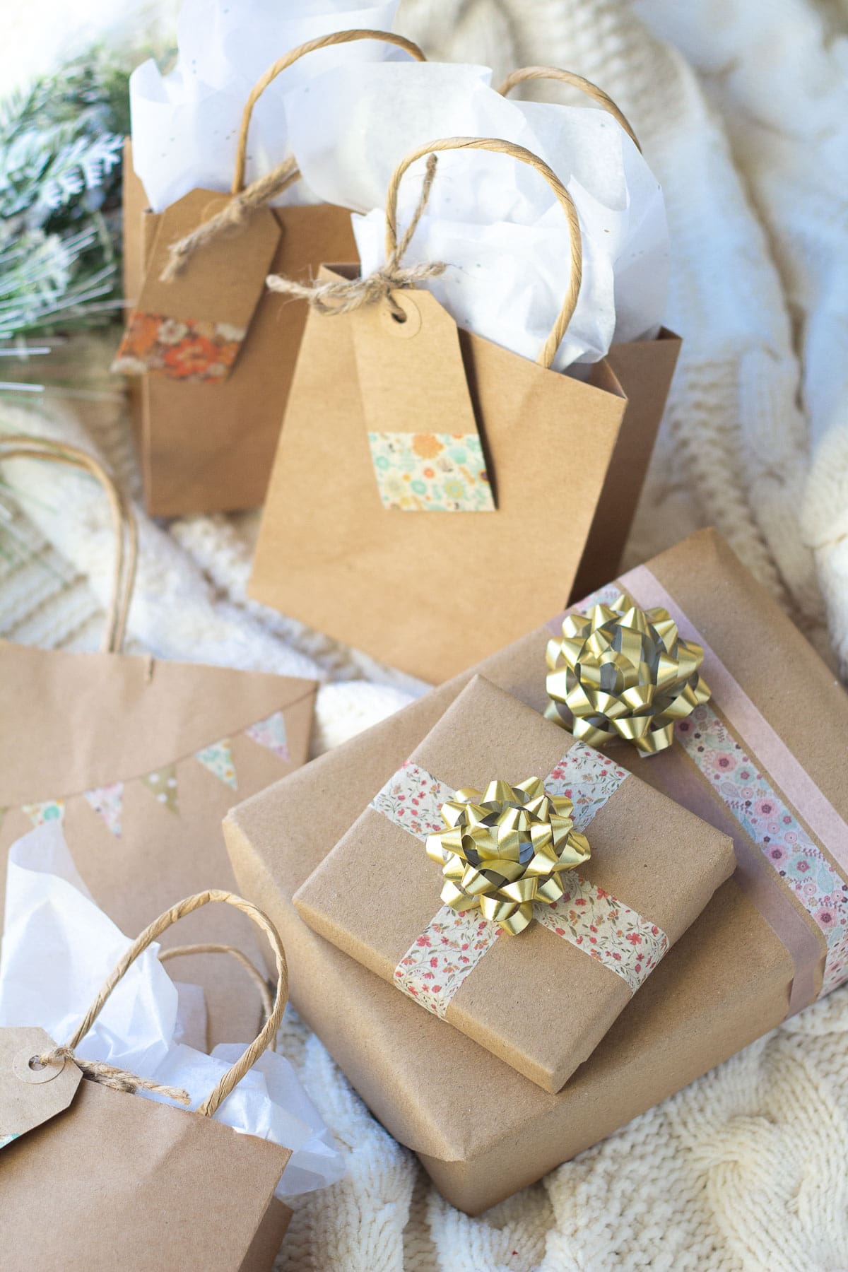 Washi tape wrapped gifts with decorative bows on the gift boxes.