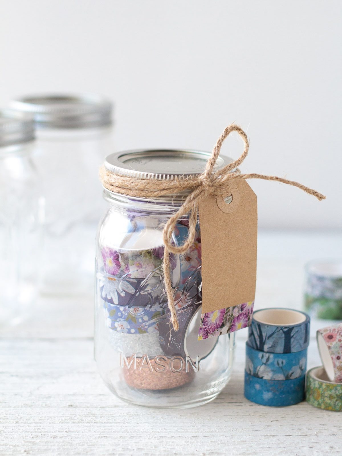 Mason jar washi tape gift idea tied with a gift tag.