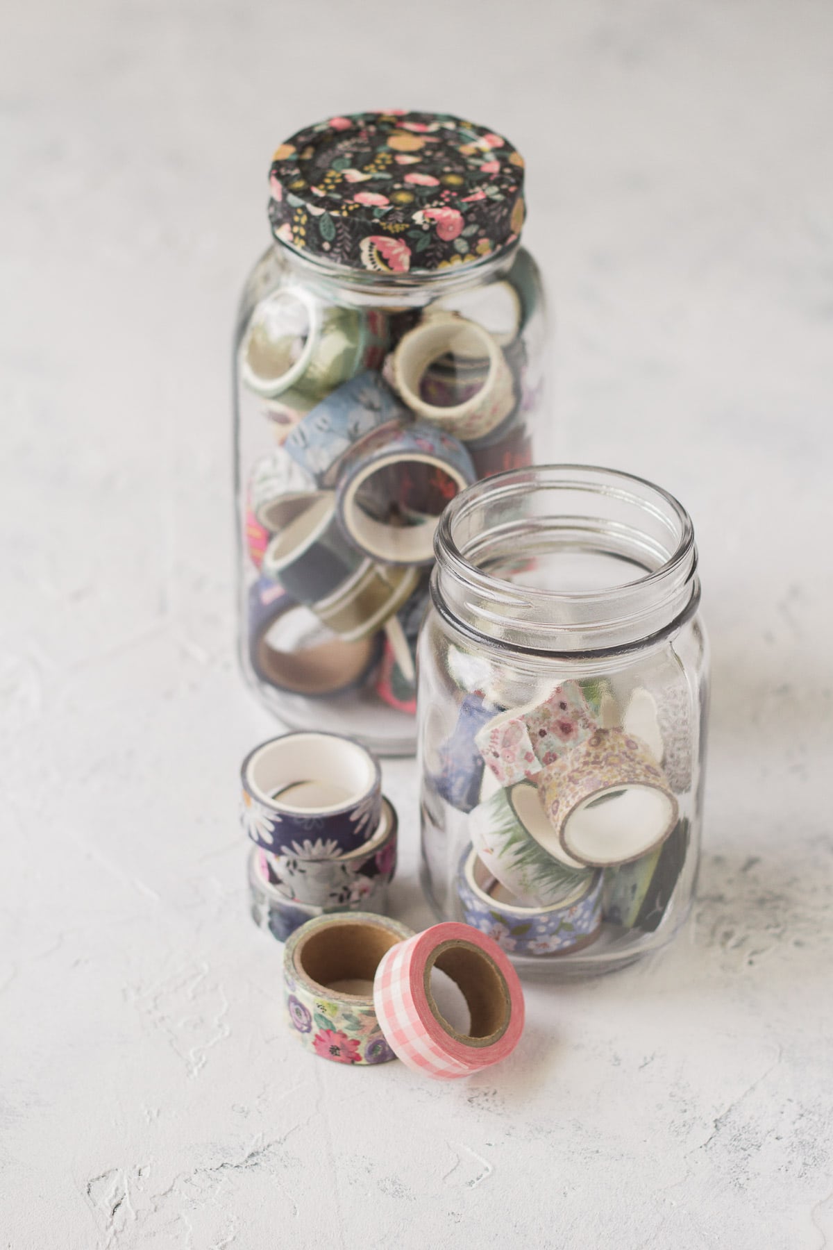 Washi tape displayed in mason jars.