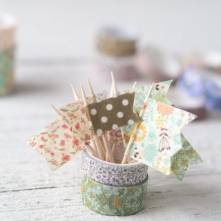 Mini flags created with washi tape and toothpicks.