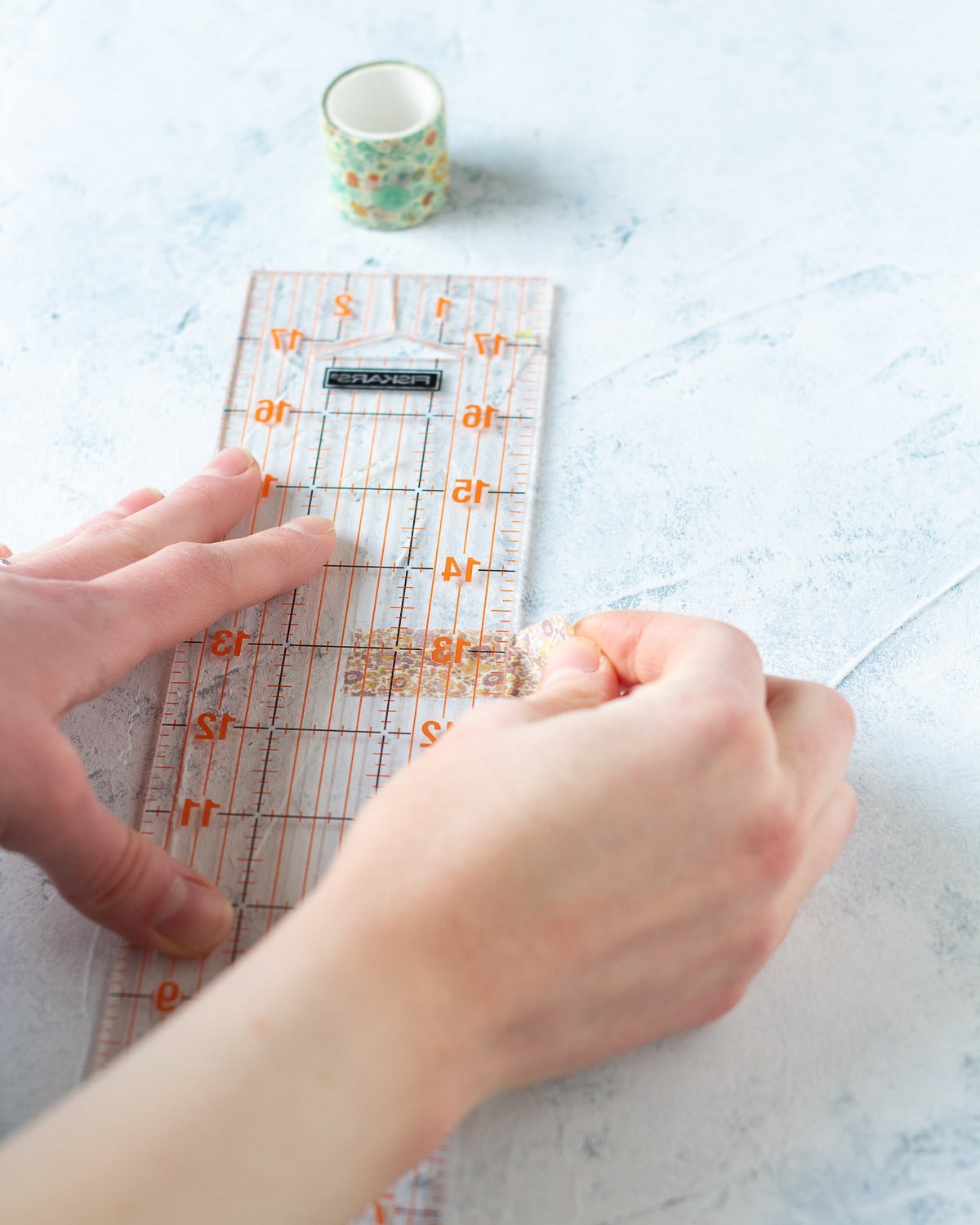 How to use a ruler to trim washi tape.