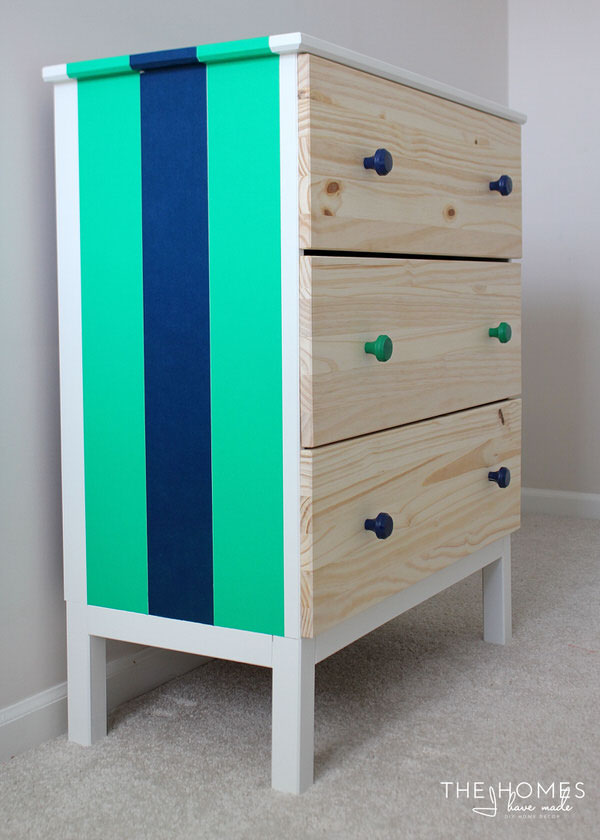 An IKEA dresser decorated with brightly colored washi tape up the side.