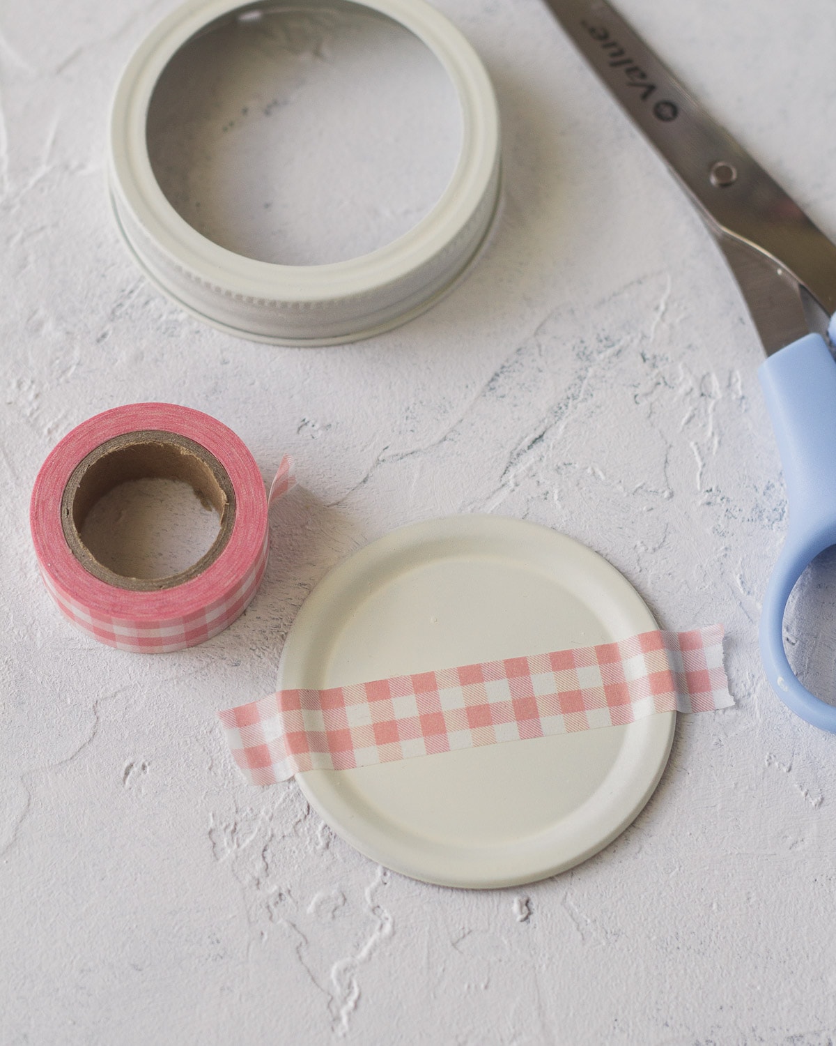 Glass jar lid with washi tape.