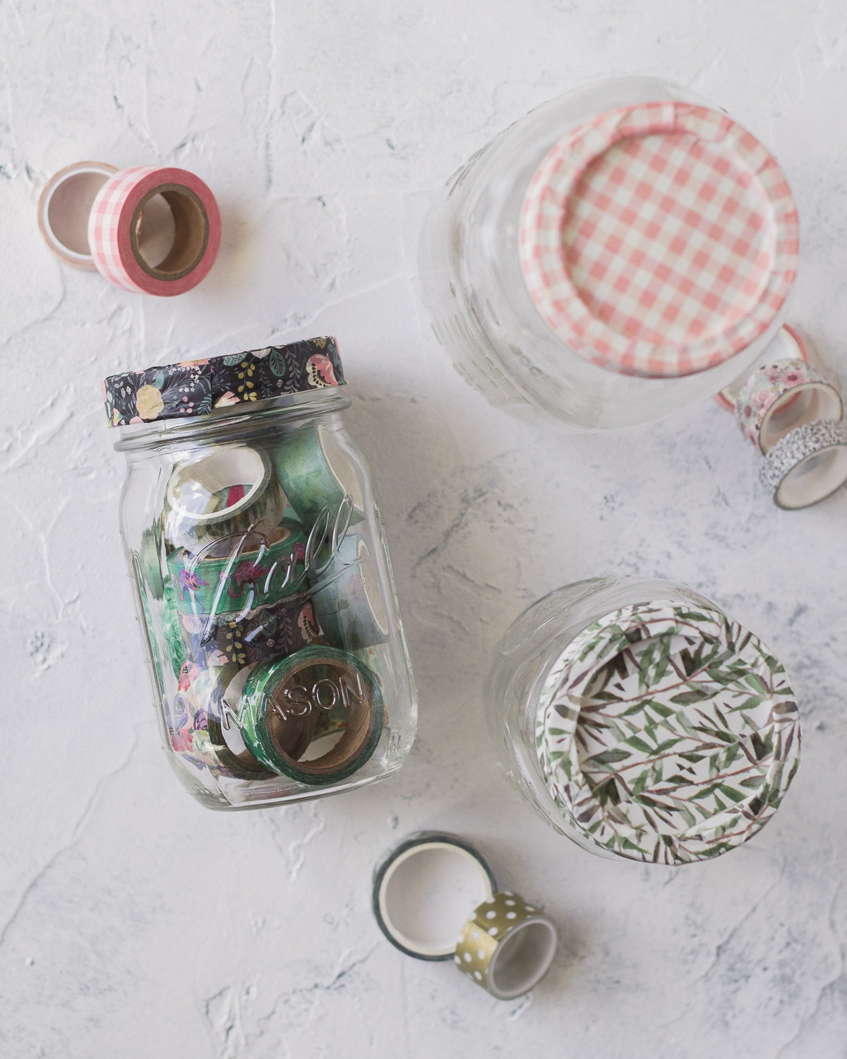 Mason jars filled and covered with washi tape.