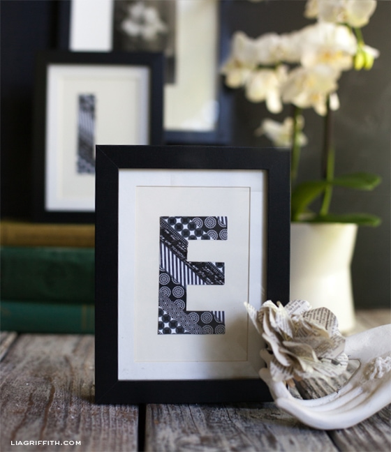 A framed monogram letter made with washi tape.