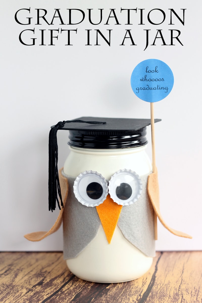 A mason jar decorated as an owl for a graduation gift.