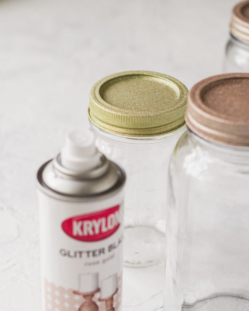 Glitter spray paint and glitter mason jar lids.