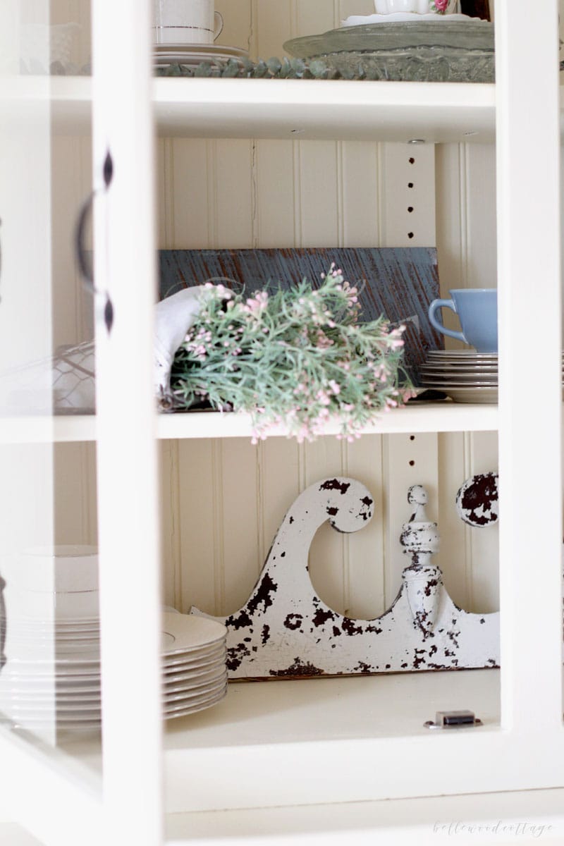 Using chippy vintage salvage pieces in a farmhouse hutch.