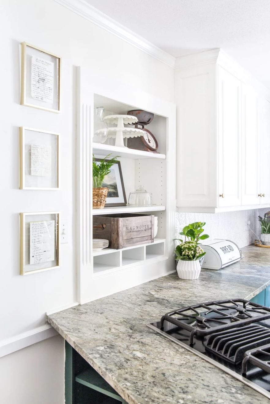 Framed handwritten recipes in a farmhouse kitchen.