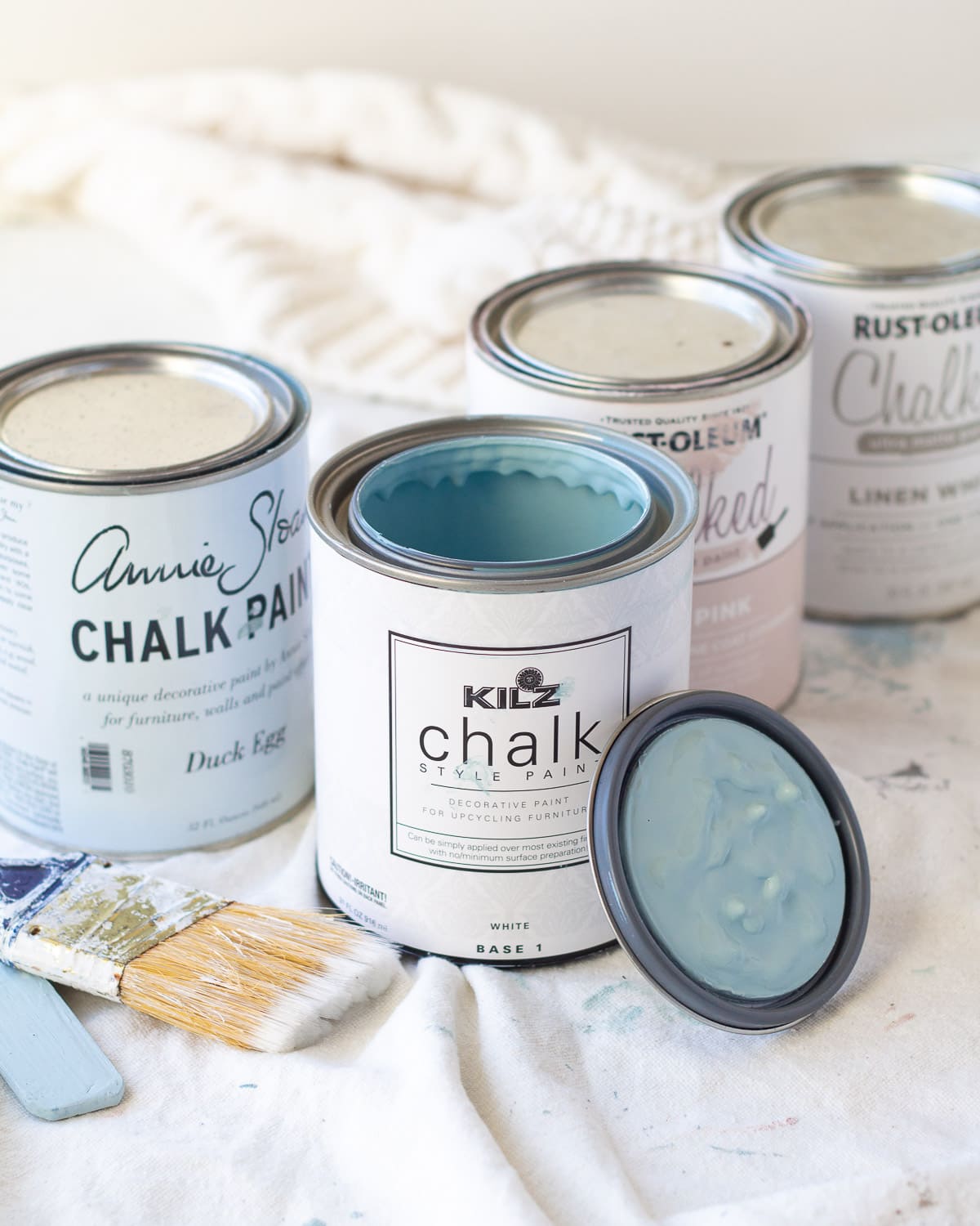 An open can of blue KILZ chalk style paint.