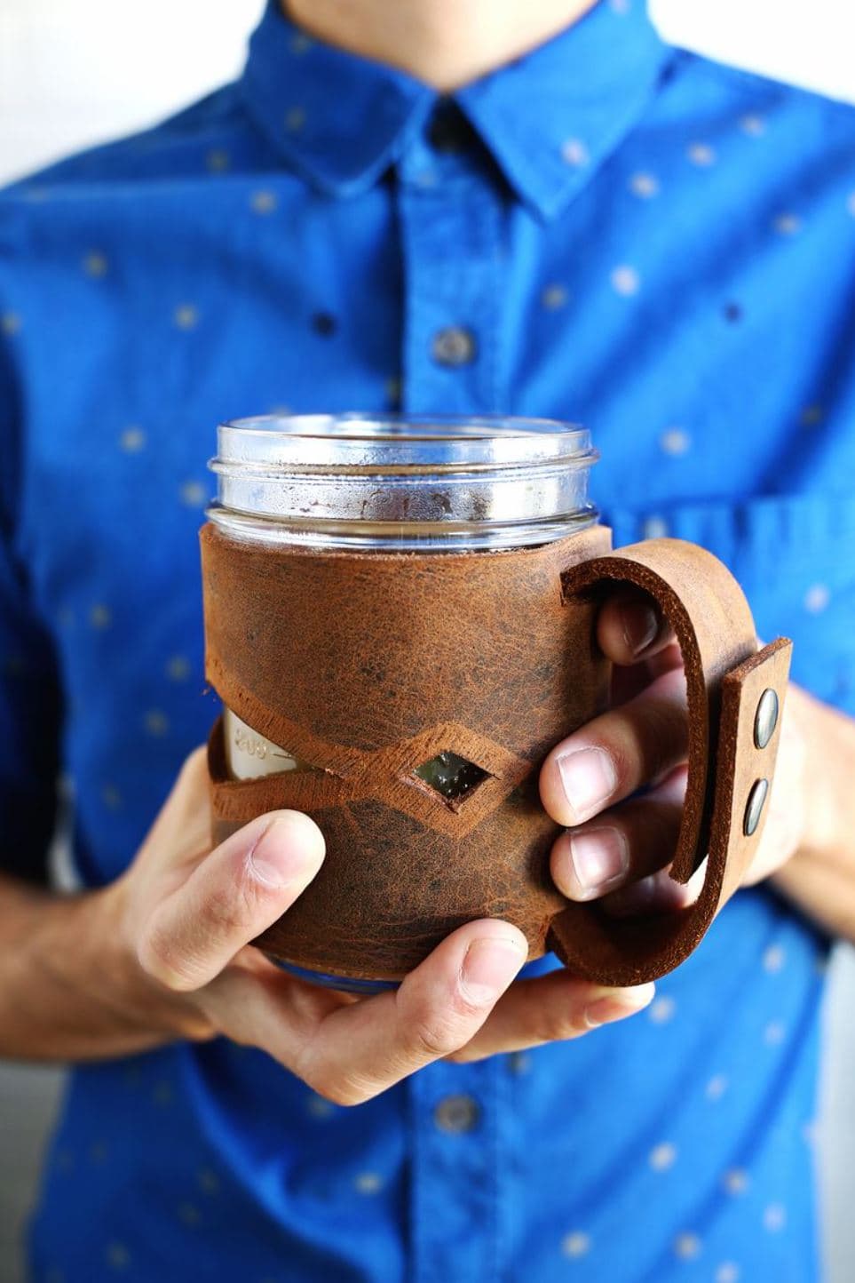 A leather sleeve for a mason jar.