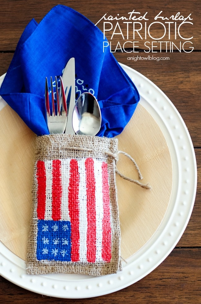 A small burlap bag painted with an American flag and used in a table setting.