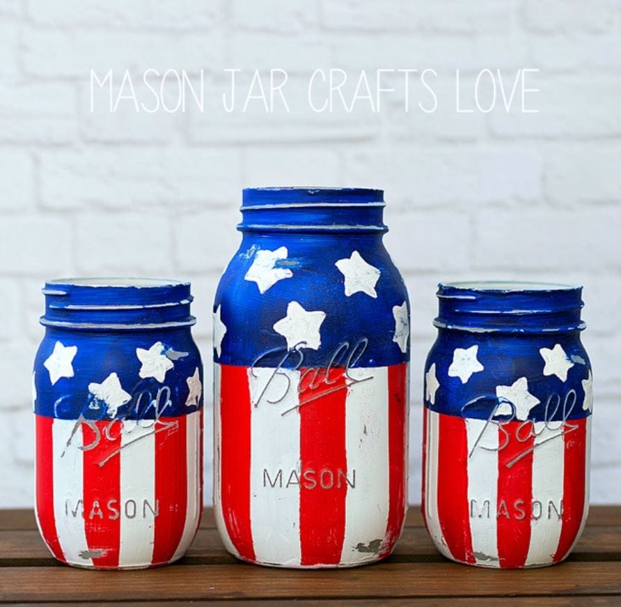 Three mason jars painted in red, white, and blue.