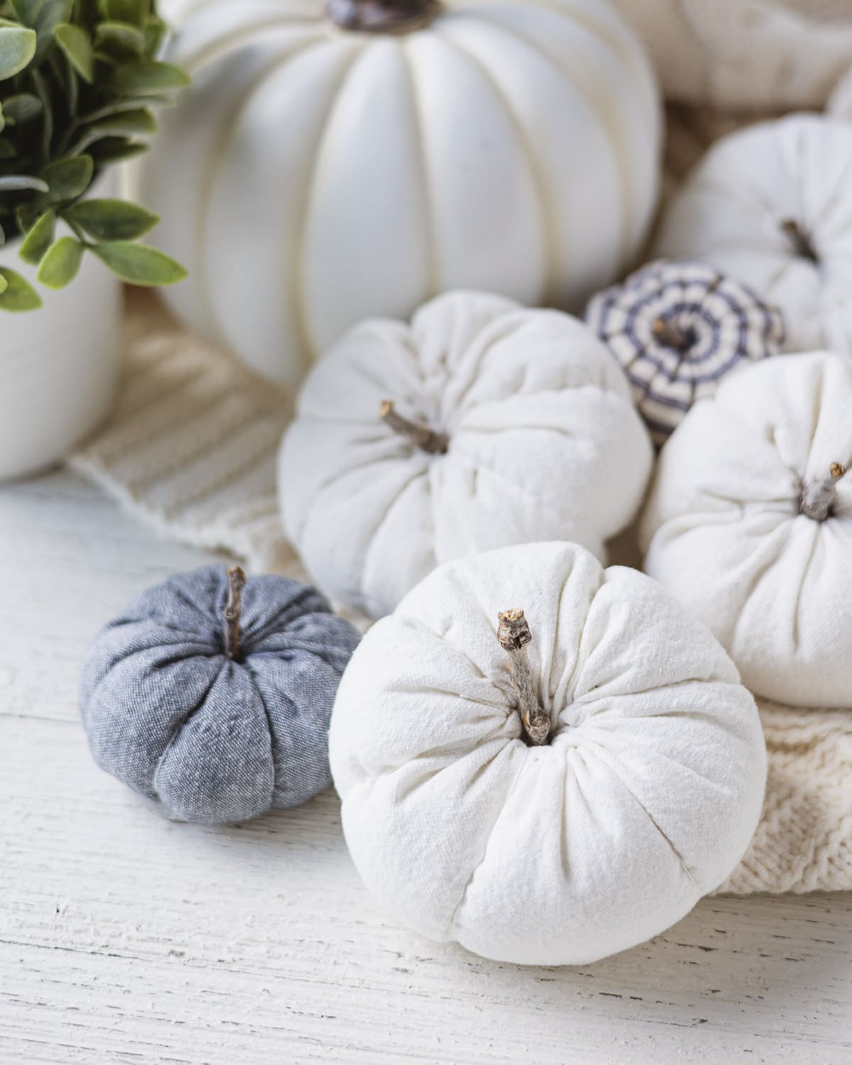 Drop cloth and linen pumpkins handmade with sticks for stems.