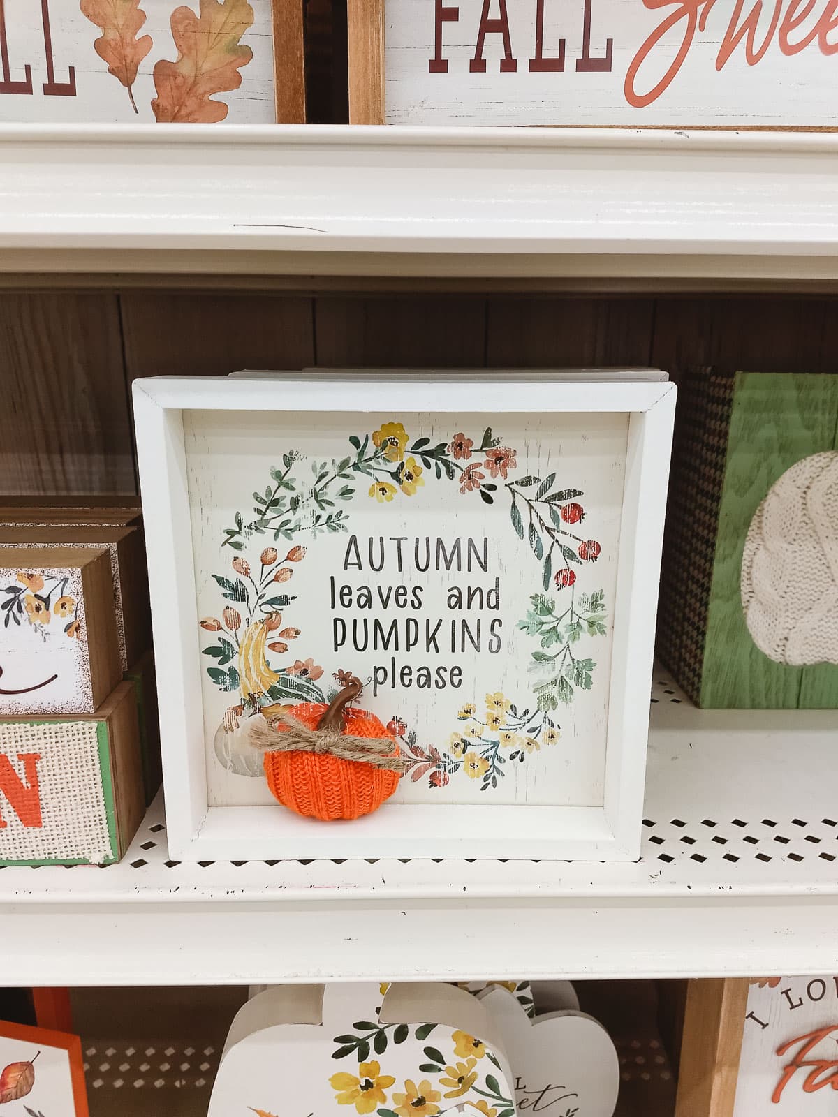A fall sign at Michael's that reads, "Autumn Leaves and Pumpkins Please".
