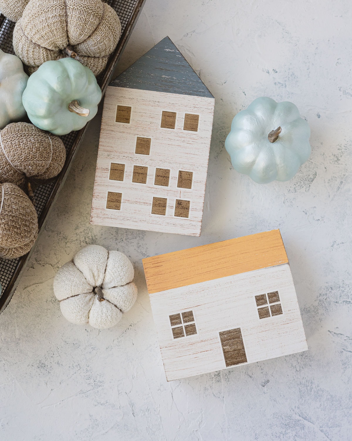 Painted wooden houses from Target and sock pumpkins.