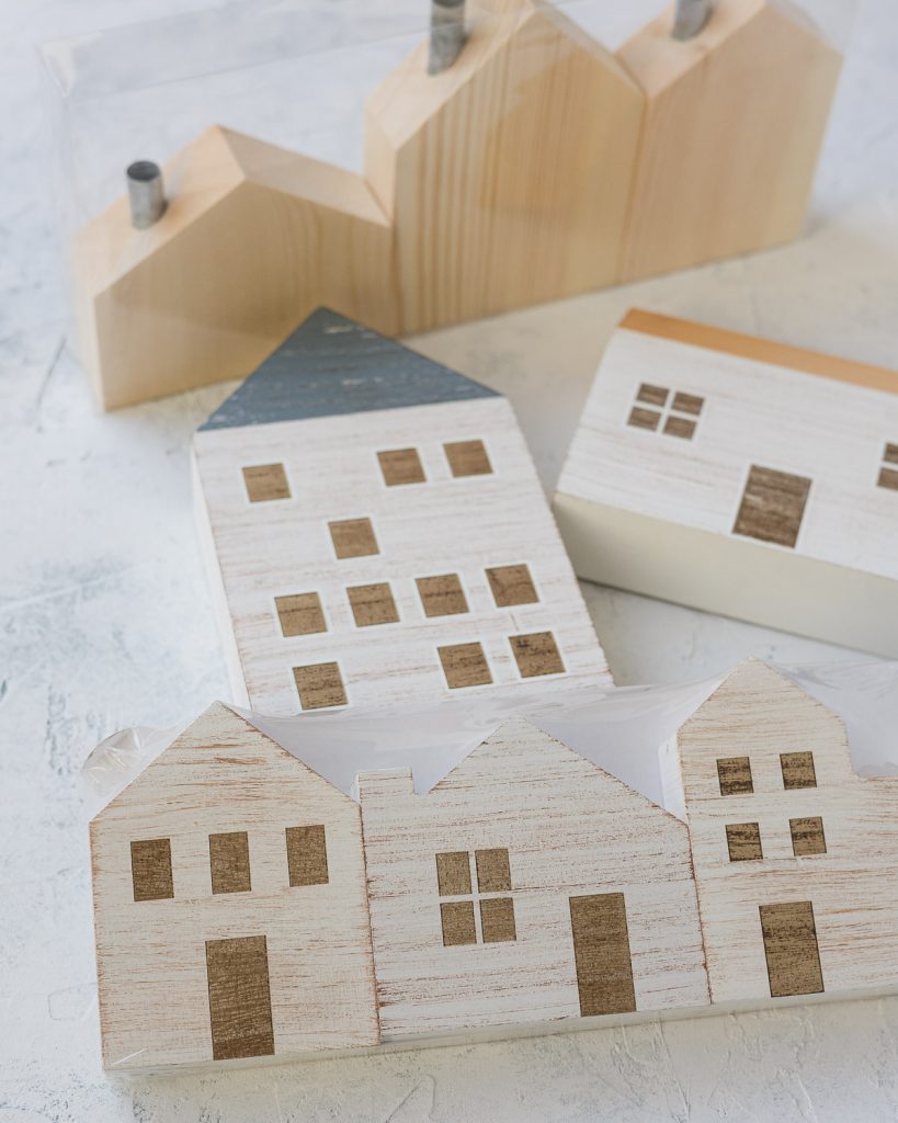 An assortment of painted wooden houses from Target.