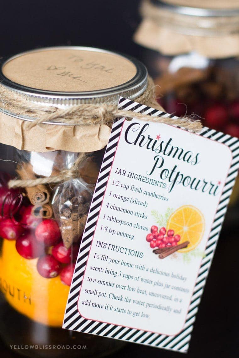 A jar filled with Christmas Potpourri and a gift tag with ingredients and instructions.