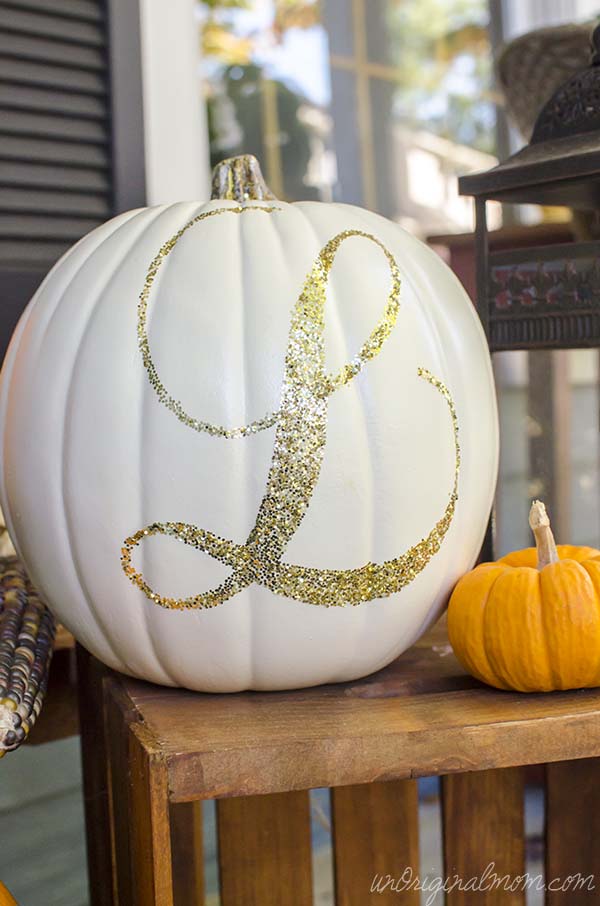 Easy pumpkin craft of a white pumpkin with a glitter monogram.