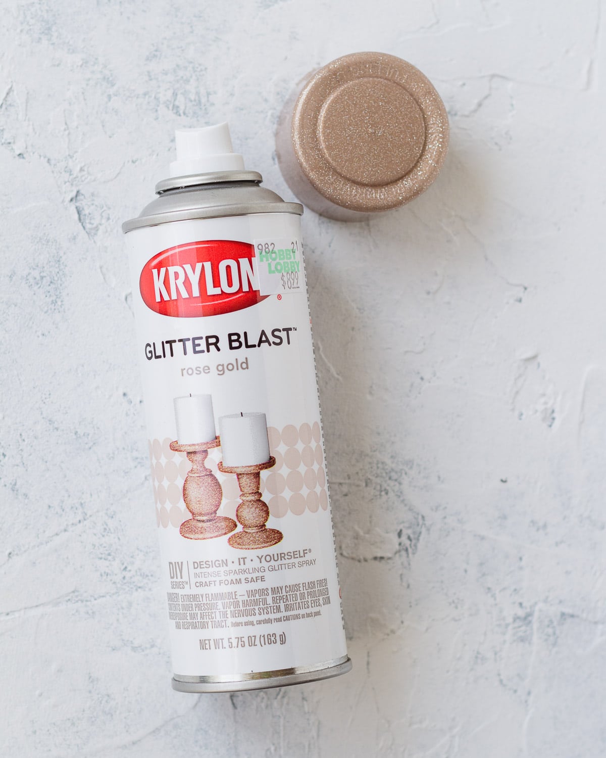 An open can of Krylon Glitter Blast Rose Gold Spray Paint.