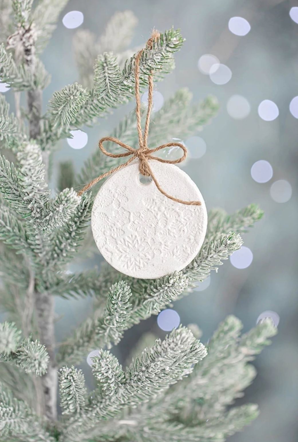 A patterned salt dough ornament hanging on a tree.