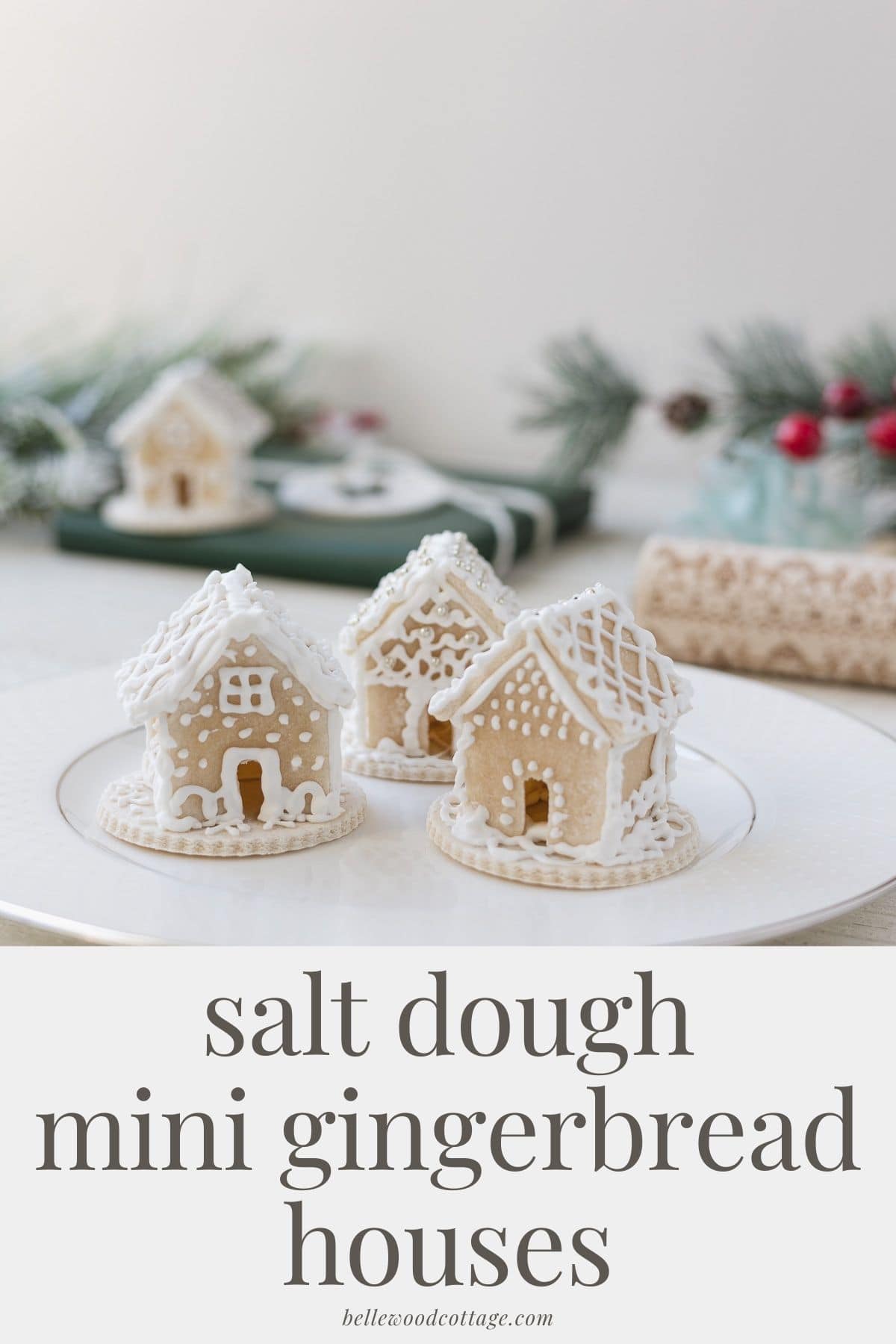 Three mini gingerbread houses decorated with royal icing with the words, "Salt Dough Mini Gingerbread Houses".