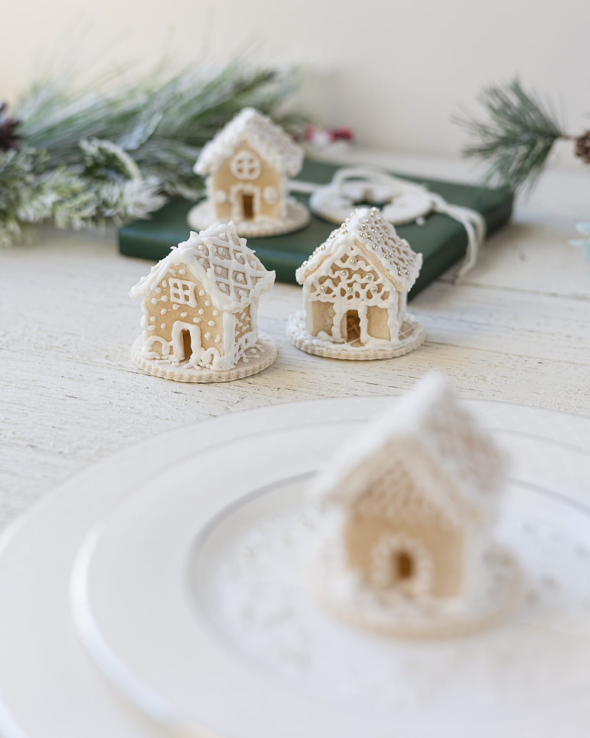 Mini gingerbread houses decorated with royal icing.