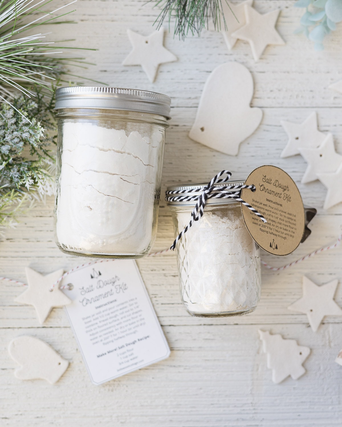 Two salt dough mix jars surrounded by dried salt dough ornaments.